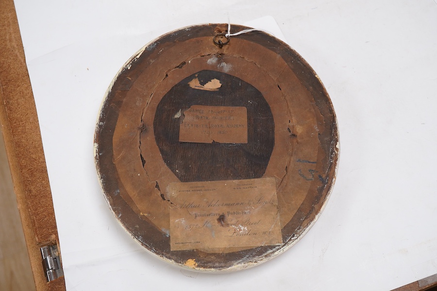 Attributed to John James Masquerier (1778-1855), portrait of a young girl holding a tabby cat, Arthur Ackermann label and ink inscription verso, oval oil, 15.5 x 12.5cm